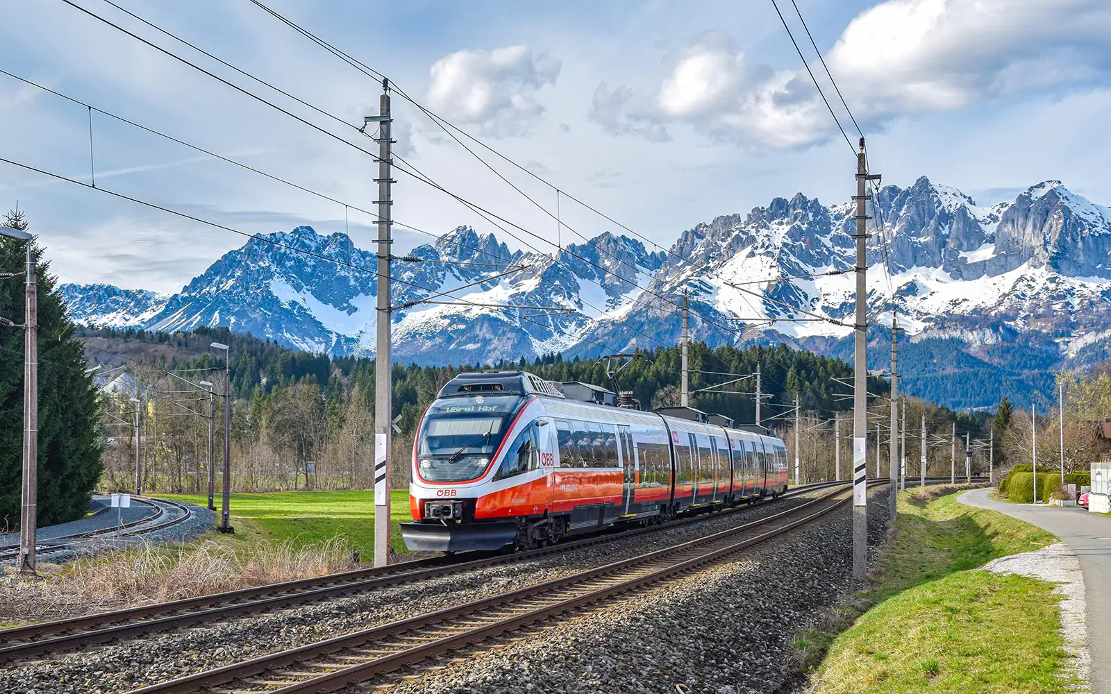 Regional train travelling through the Salzburg Alps